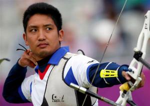 Japan's Yu Ishizu takes aim during the men's archery team eliminations at the Lords Cricket Ground during the London 2012 Olympics Games